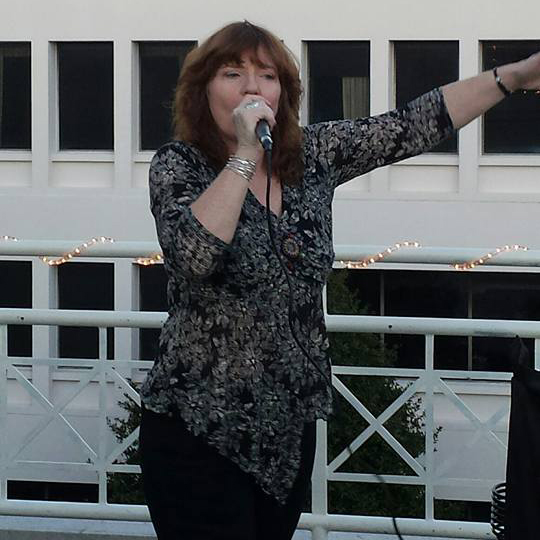 Dona performing on top of the Strand Theater in Marietta, GA